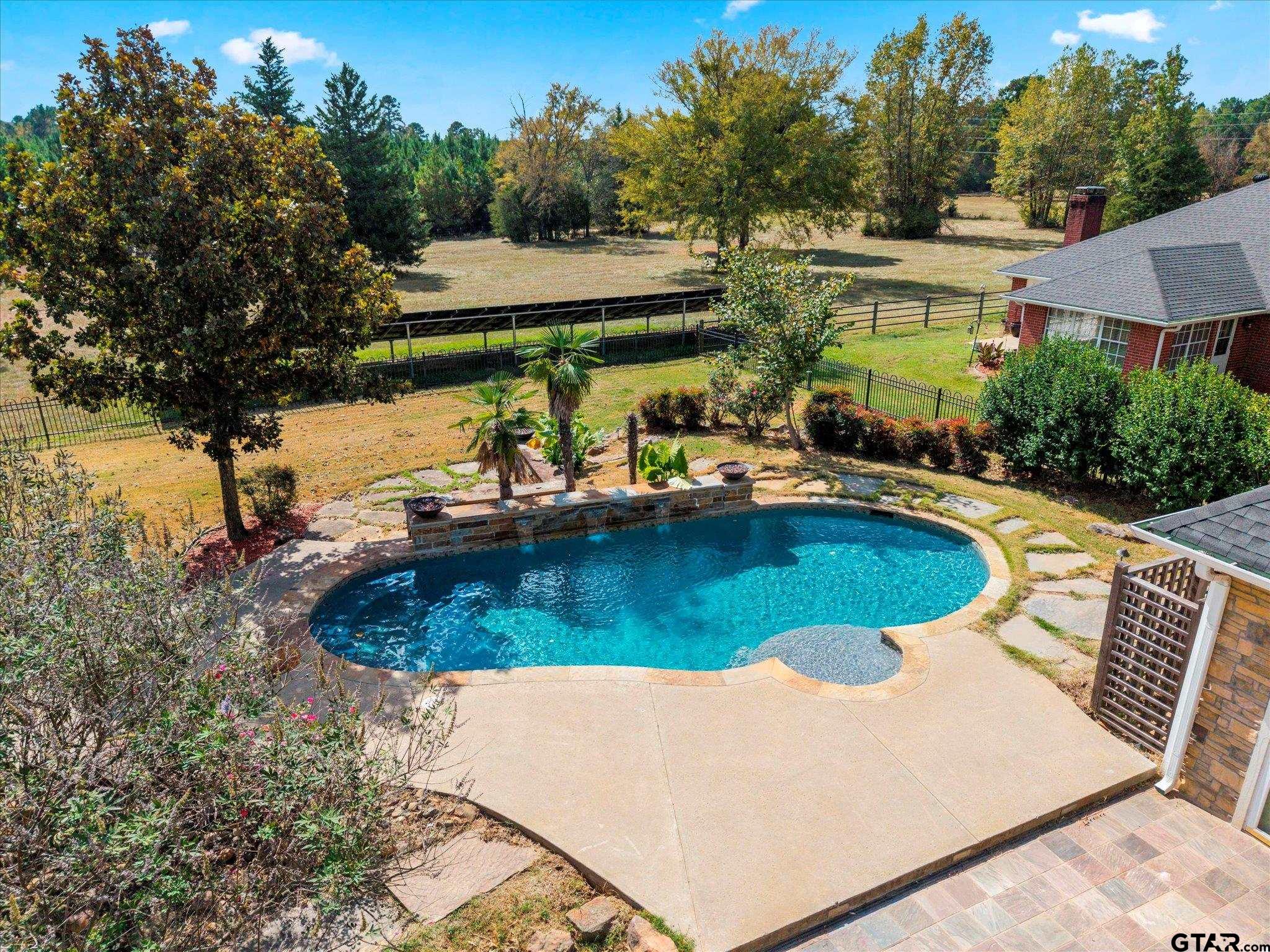 1879 Fig Road Gilmer, TX 75645 - Photo 9 of 46 an aerial view of a house with swimming pool and patio