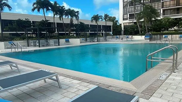 a room with pool table and a potted plant