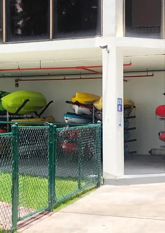 a roof deck with table and chairs