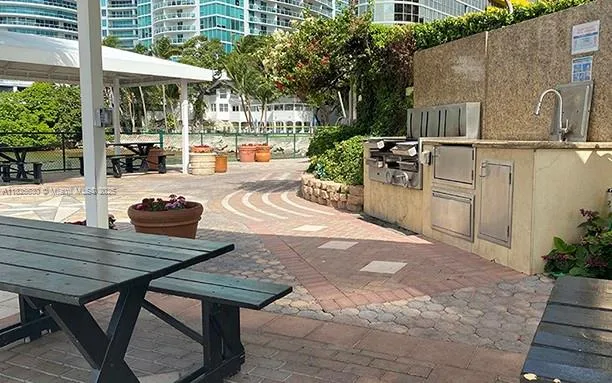 a view of a dinning table and chairs in the patio