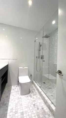 a bathroom with a double vanity sink and mirror
