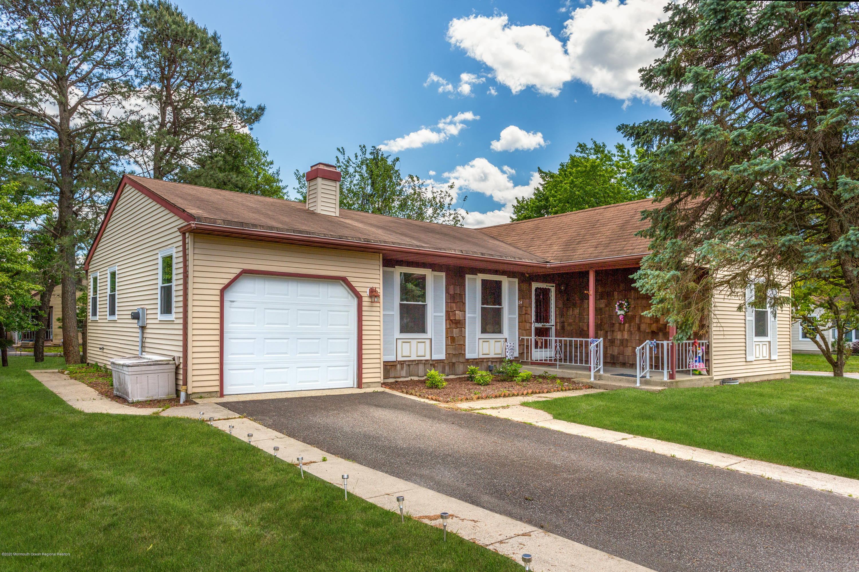 84 Sunset Road, Unit 60 Whiting, NJ 08759 - Photo 1 of 51 a front view of house with yard and green space