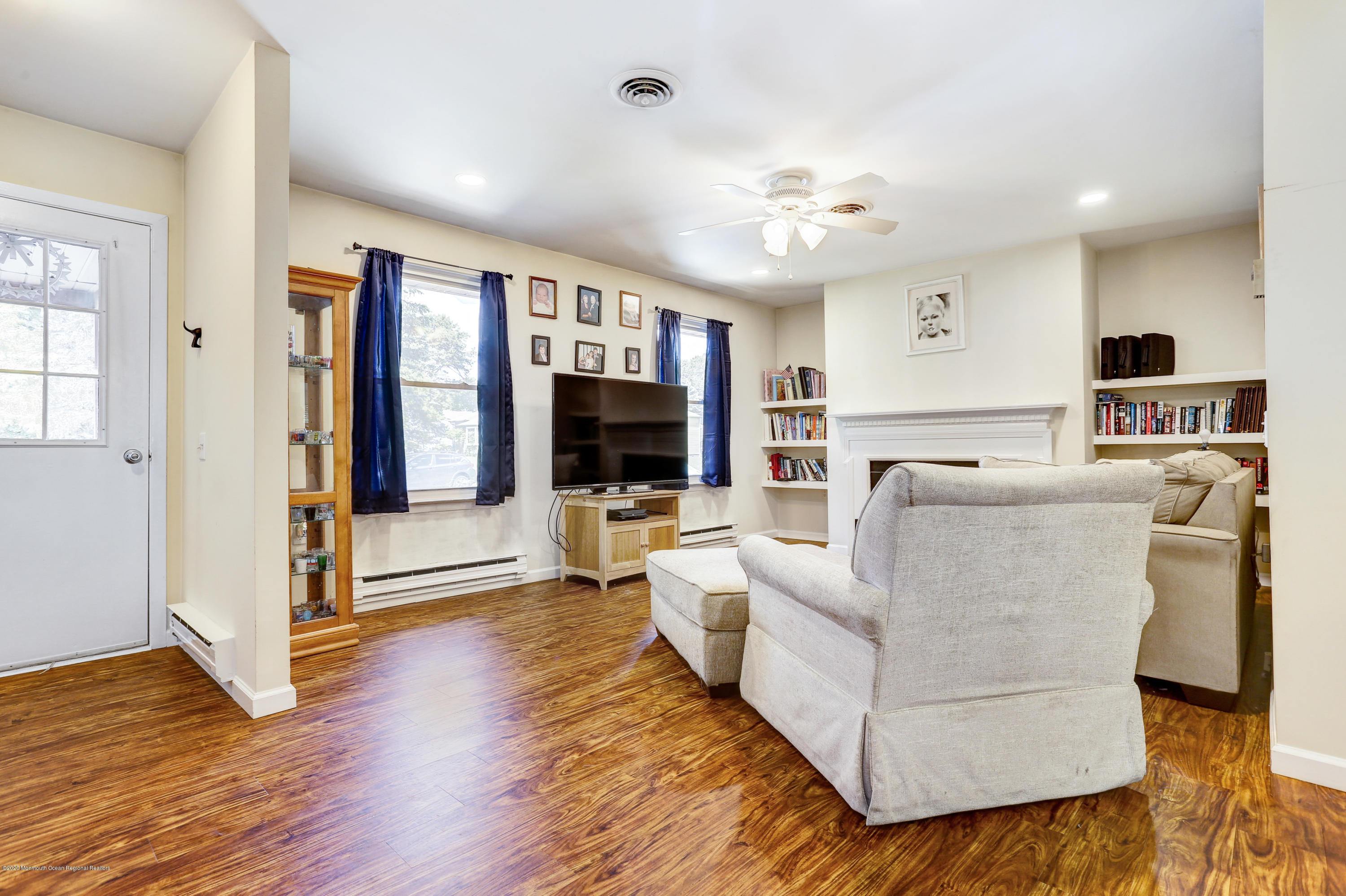 84 Sunset Road, Unit 60 Whiting, NJ 08759 - Photo 11 of 51 a living room with furniture and a flat screen tv