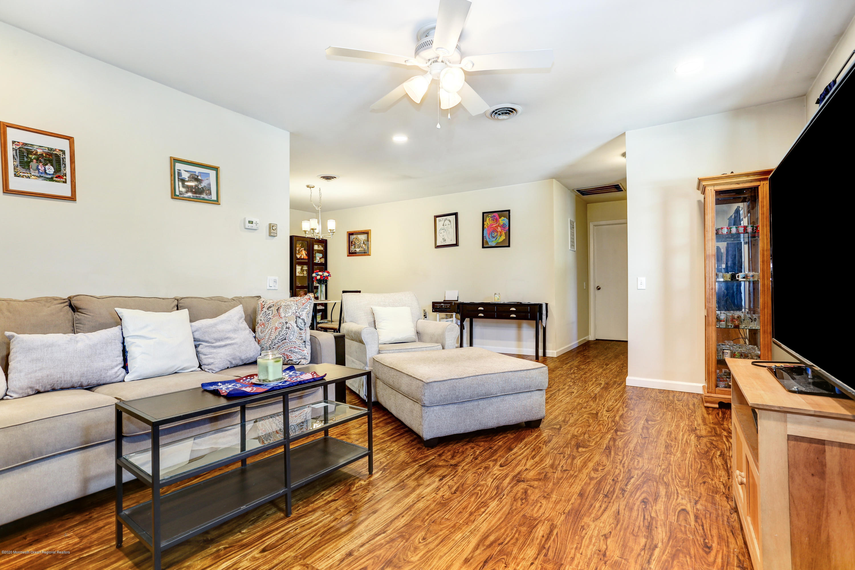 84 Sunset Road, Unit 60 Whiting, NJ 08759 - Photo 14 of 51 a living room with furniture and a flat screen tv