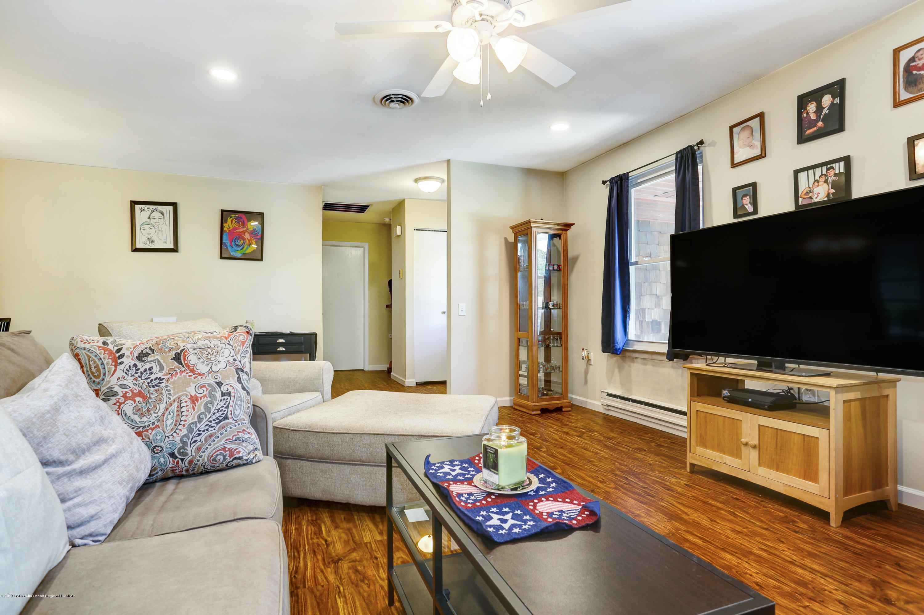 84 Sunset Road, Unit 60 Whiting, NJ 08759 - Photo 16 of 51 a living room with furniture and a flat screen tv