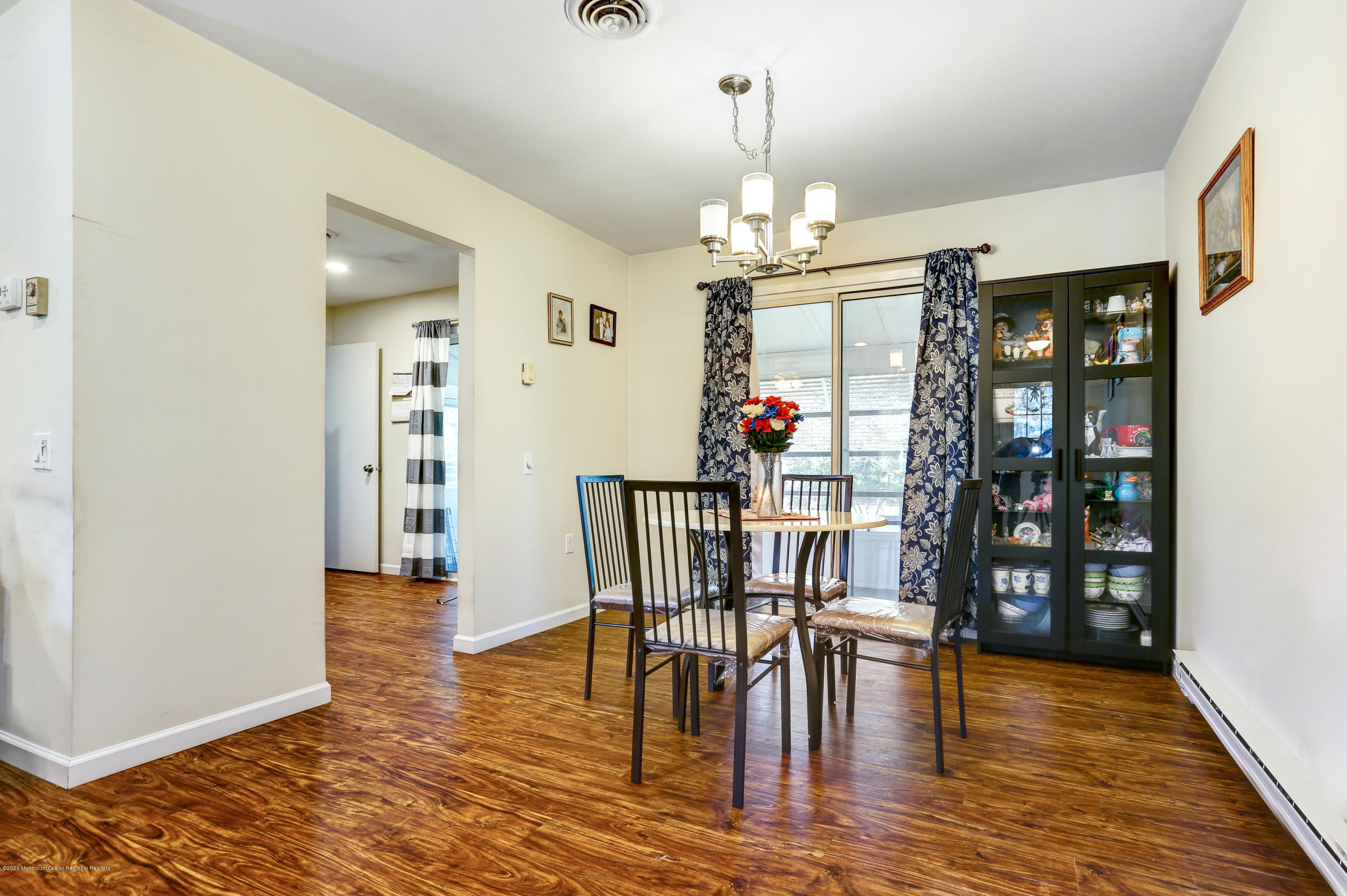 84 Sunset Road, Unit 60 Whiting, NJ 08759 - Photo 19 of 51 a view of a dining room with furniture and wooden floor