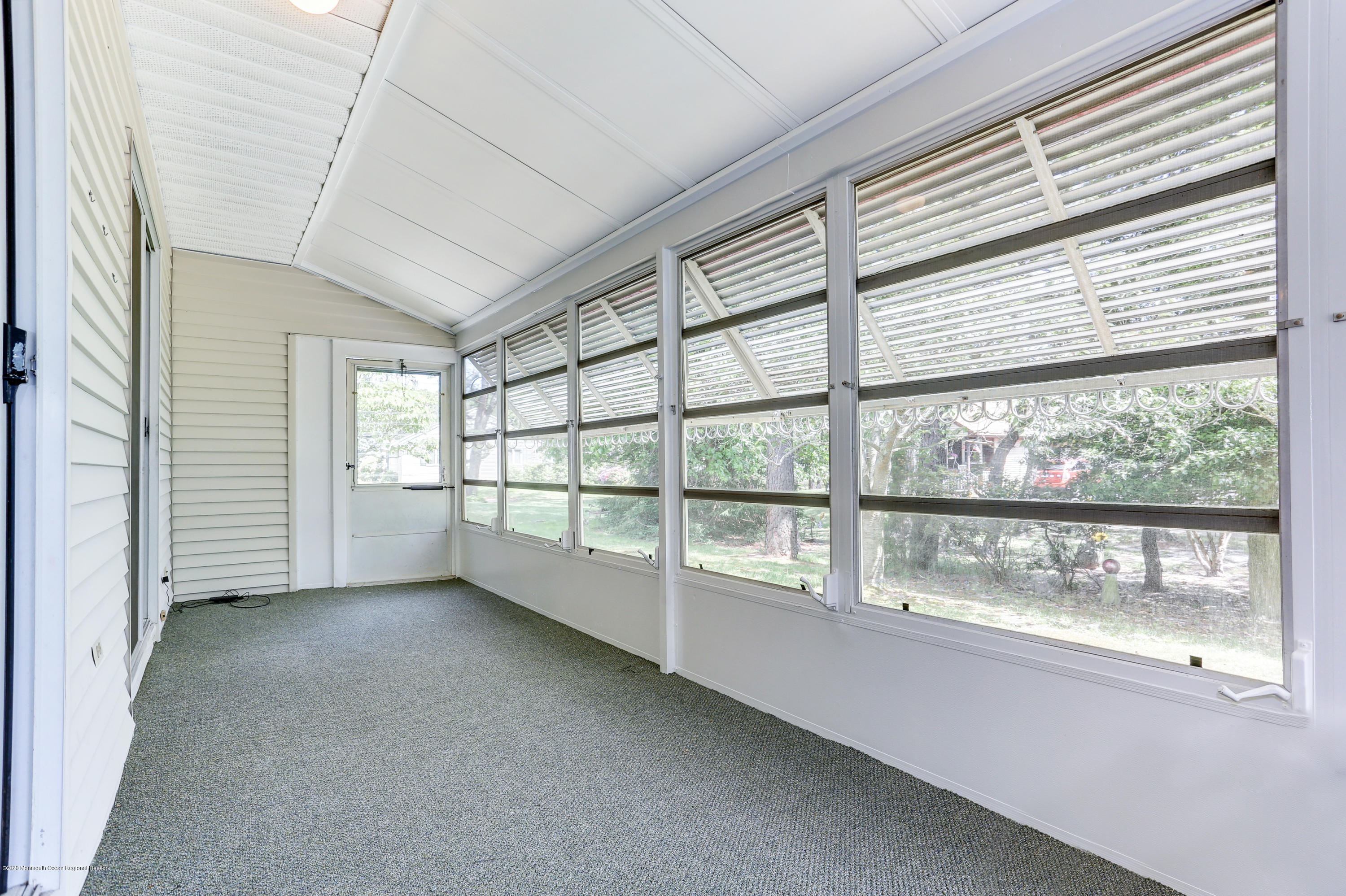 84 Sunset Road, Unit 60 Whiting, NJ 08759 - Photo 32 of 51 an empty room with large windows