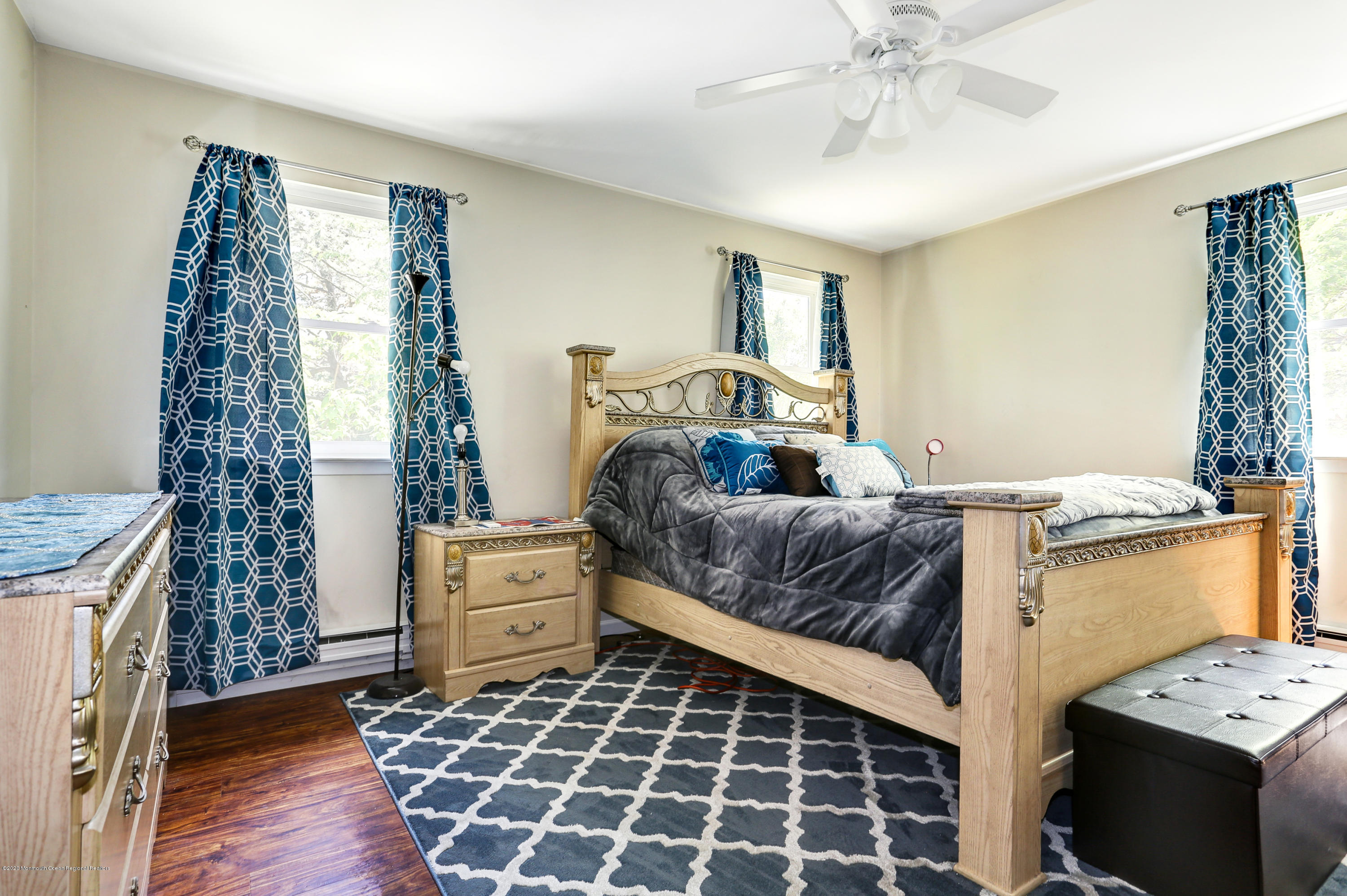 84 Sunset Road, Unit 60 Whiting, NJ 08759 - Photo 35 of 51 a bedroom with a bed and a window