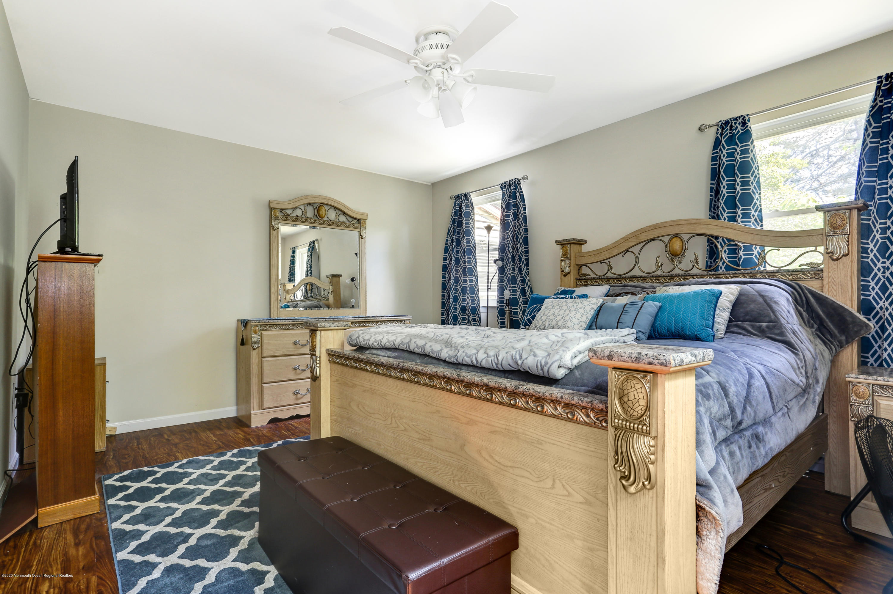 84 Sunset Road, Unit 60 Whiting, NJ 08759 - Photo 36 of 51 a bedroom with a bed and a dresser