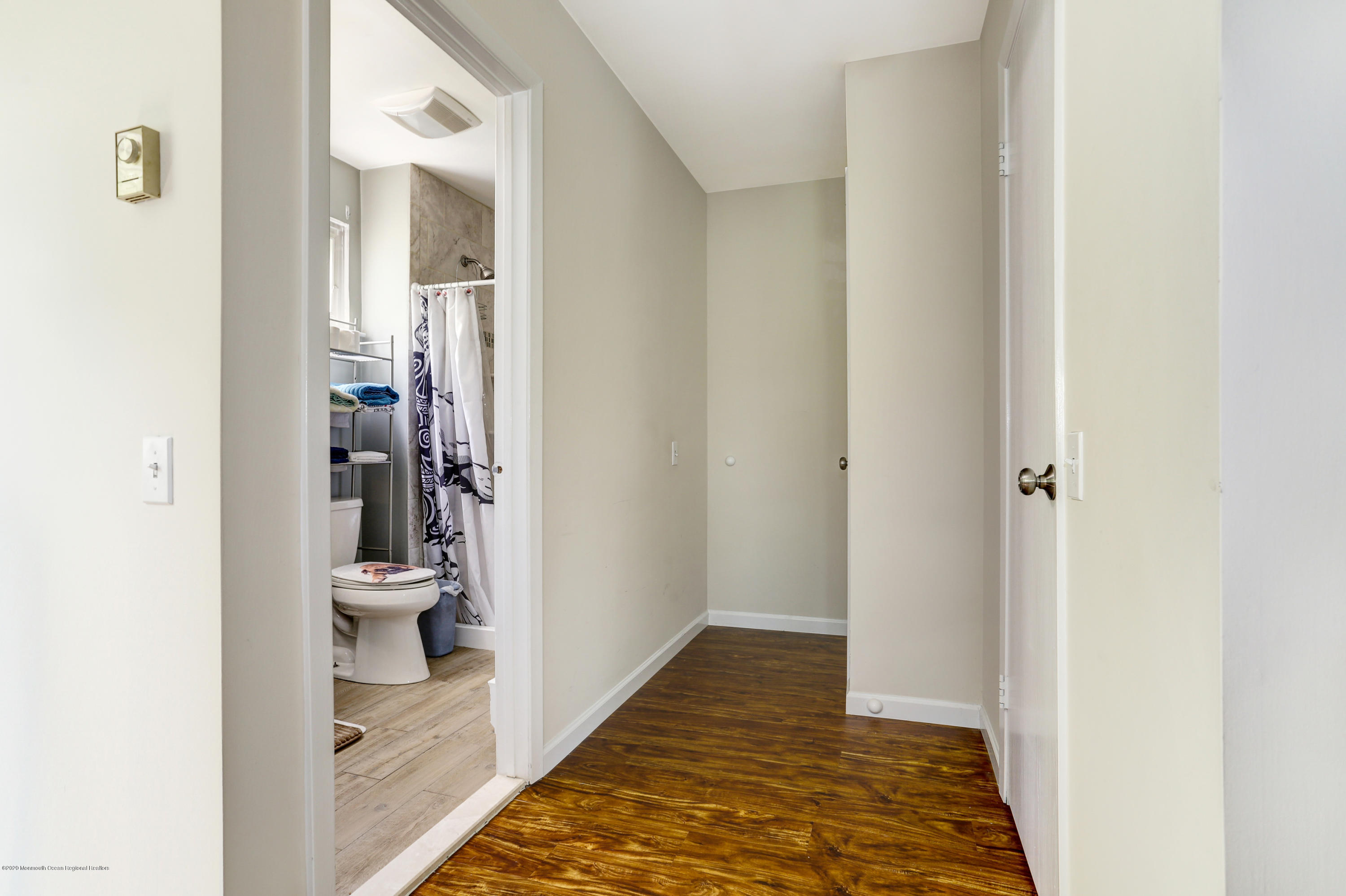 84 Sunset Road, Unit 60 Whiting, NJ 08759 - Photo 37 of 51 a view of a bathroom from a hallway
