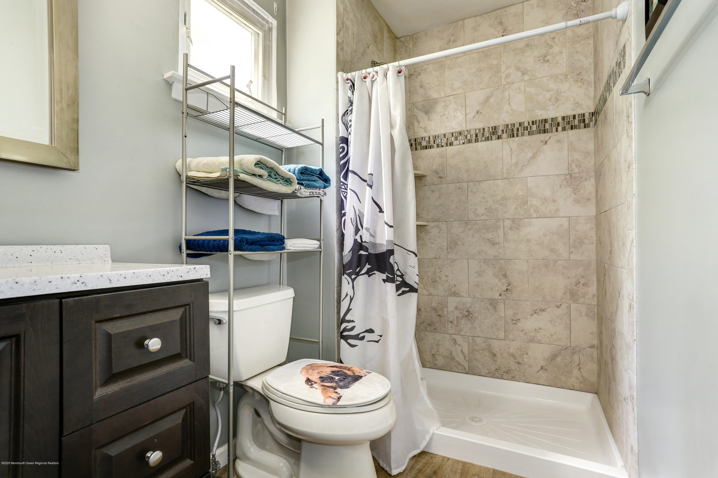84 Sunset Road, Unit 60 Whiting, NJ 08759 - Photo 39 of 51 a bathroom with a sink a toilet and shower