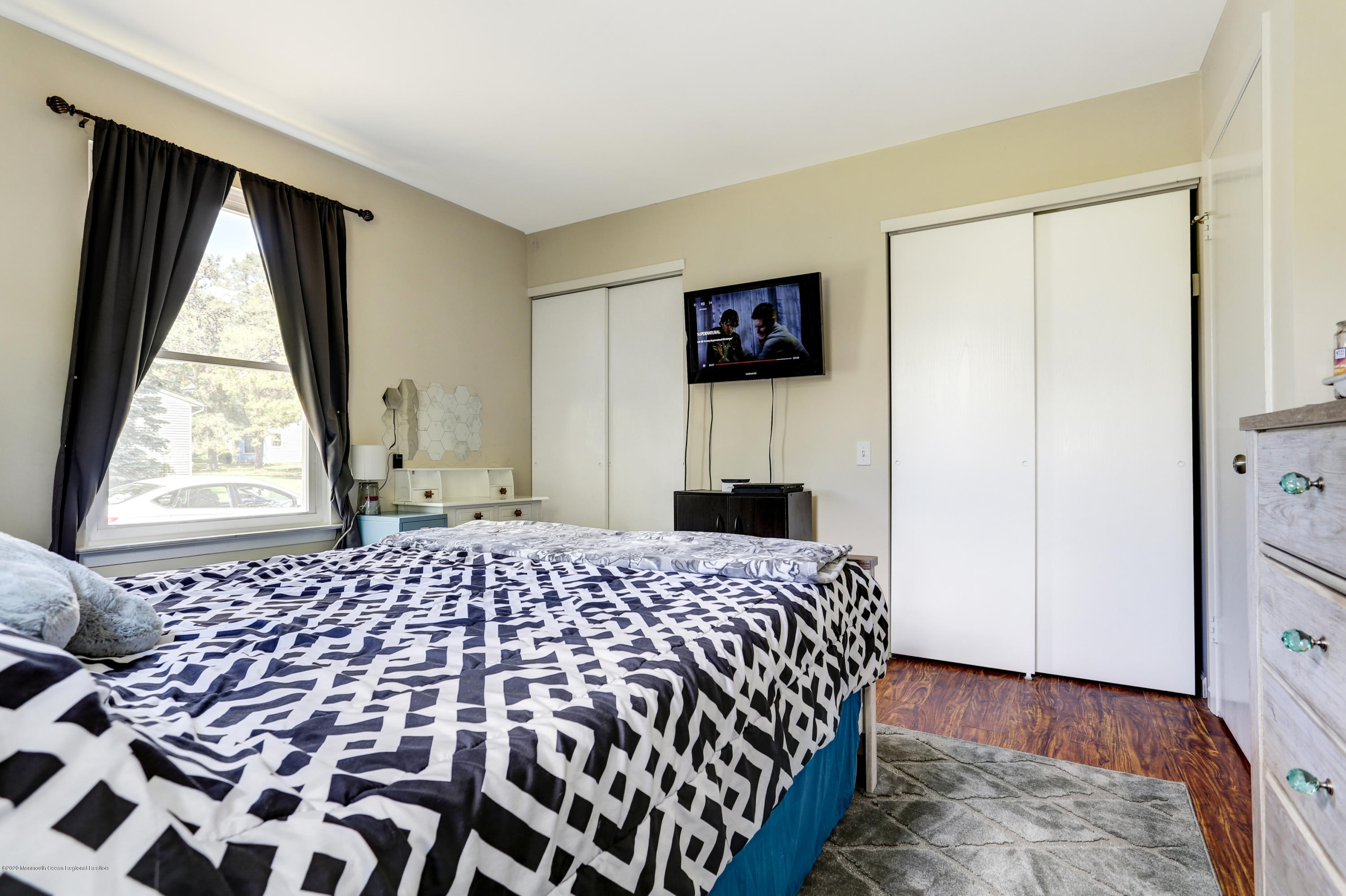 84 Sunset Road, Unit 60 Whiting, NJ 08759 - Photo 42 of 51 a bedroom with a bed and a window