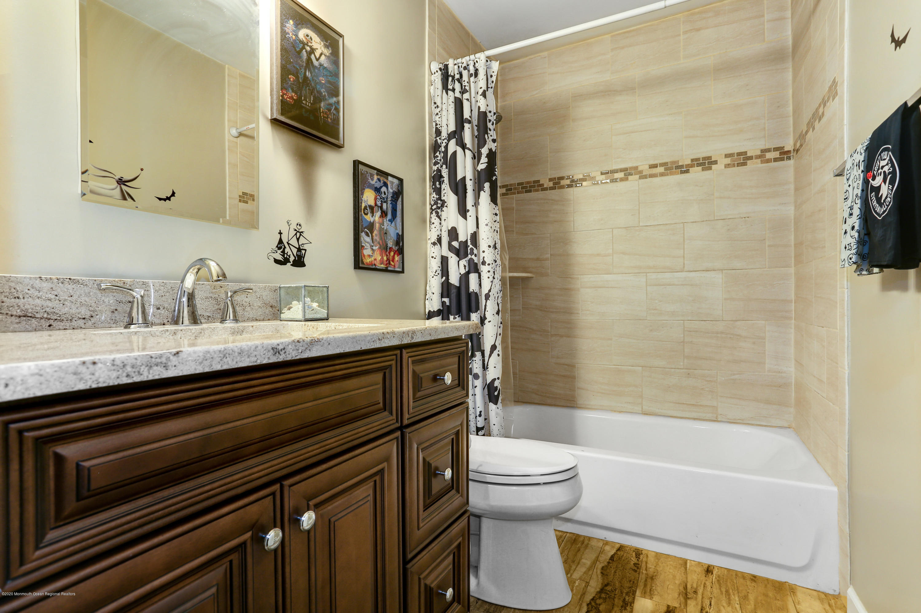 84 Sunset Road, Unit 60 Whiting, NJ 08759 - Photo 43 of 51 a bathroom with a sink a toilet and shower