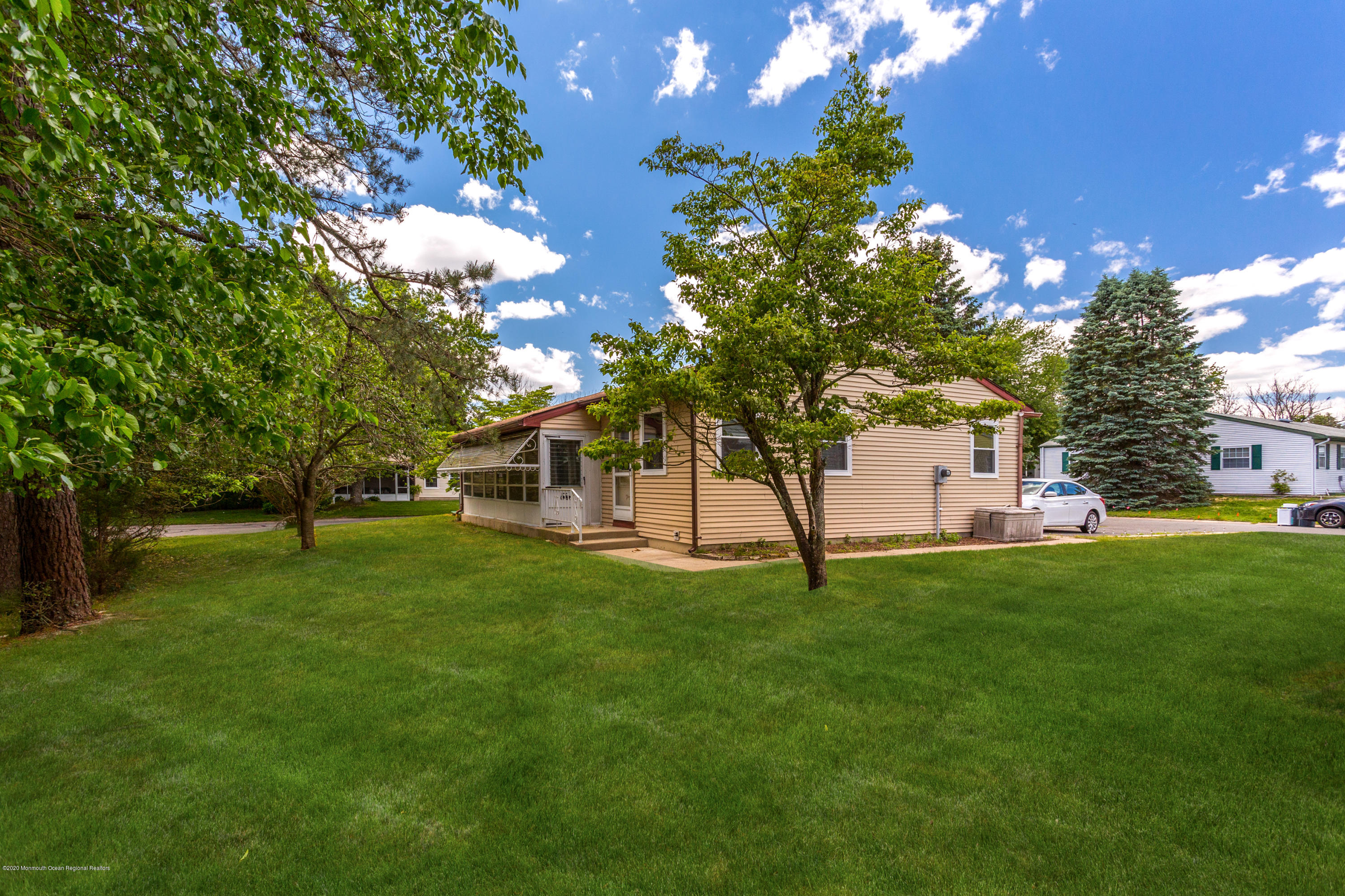 84 Sunset Road, Unit 60 Whiting, NJ 08759 - Photo 47 of 51 a garden with trees in front of it