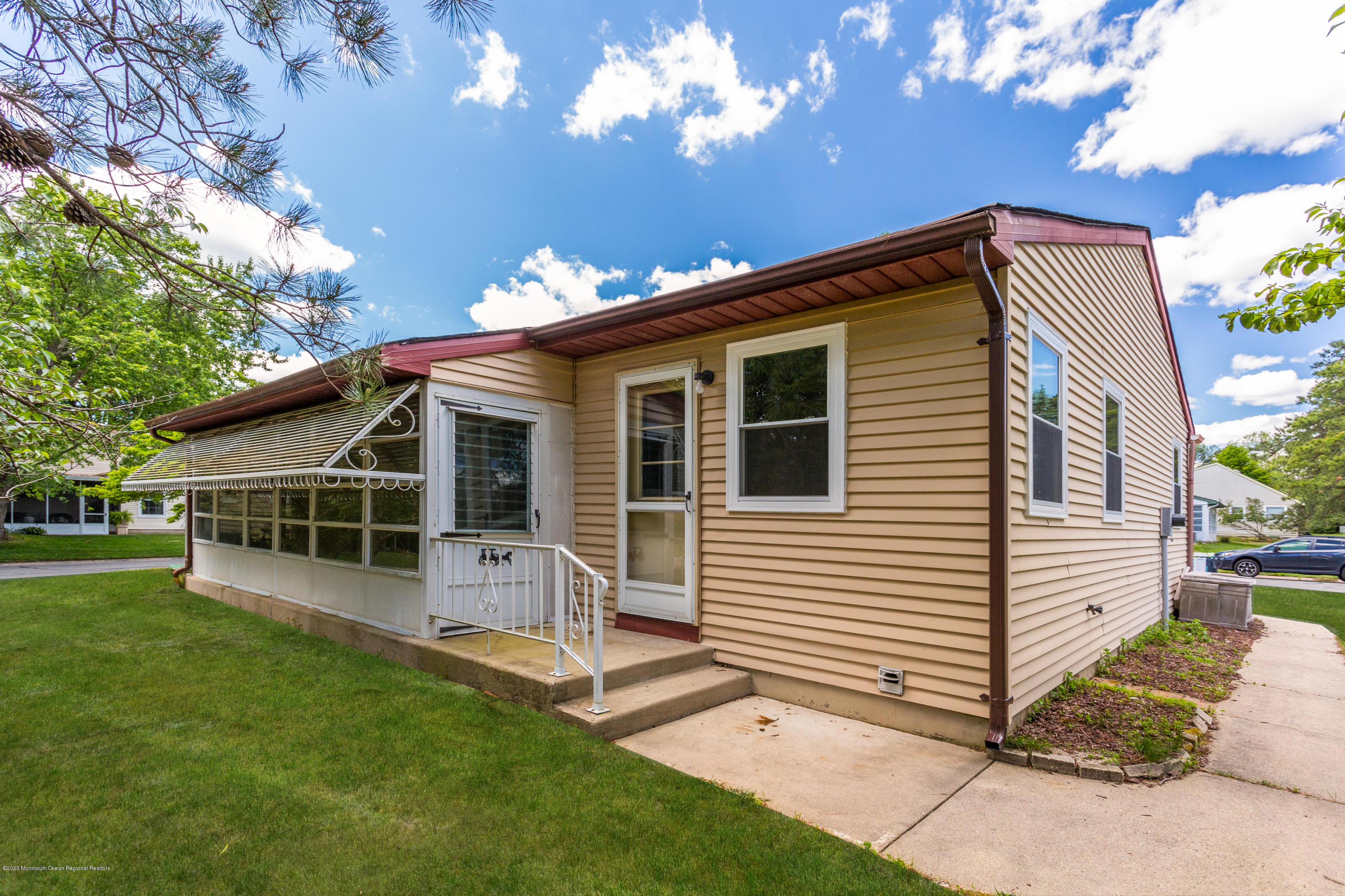 84 Sunset Road, Unit 60 Whiting, NJ 08759 - Photo 48 of 51 a view of a house with a yard
