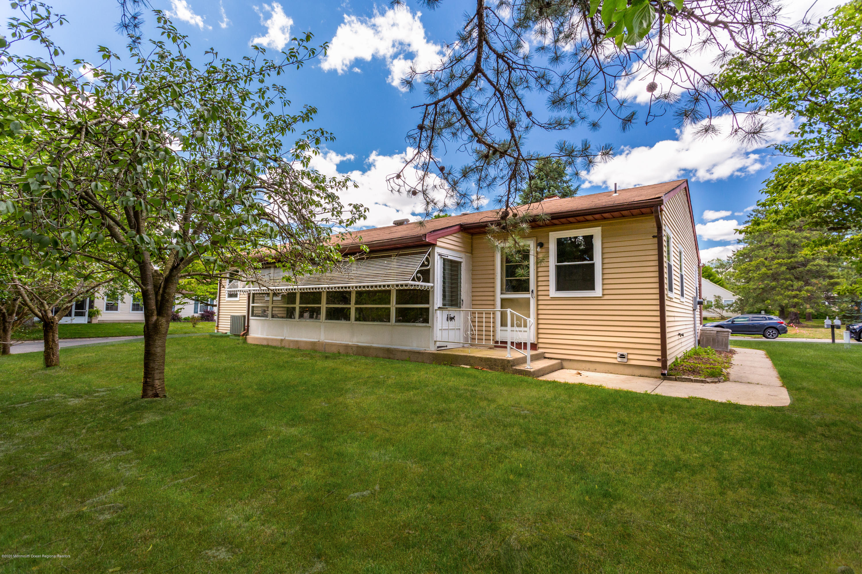 84 Sunset Road, Unit 60 Whiting, NJ 08759 - Photo 49 of 51 a view of a house with a backyard