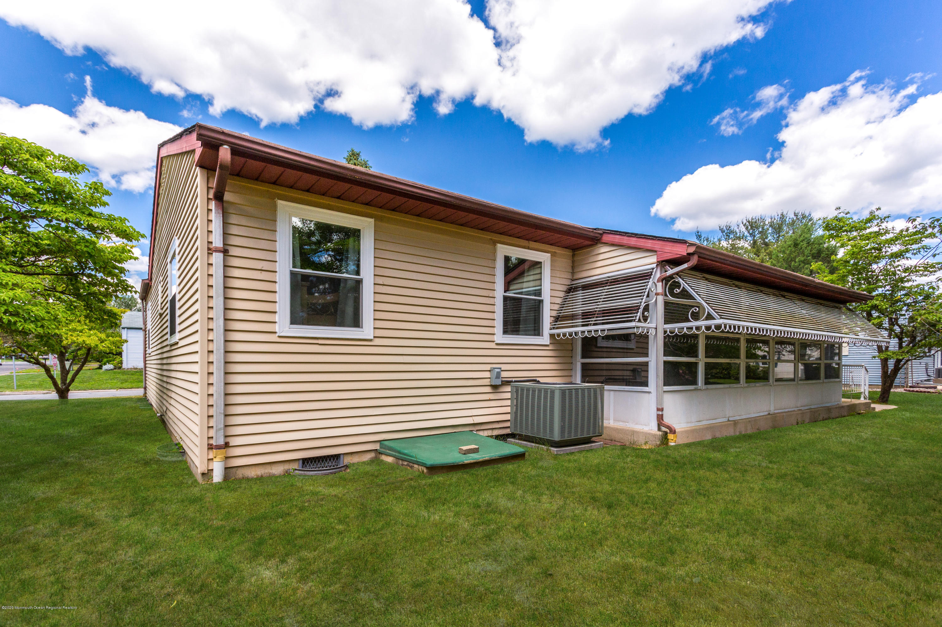 84 Sunset Road, Unit 60 Whiting, NJ 08759 - Photo 50 of 51 a front view of a house with a garden