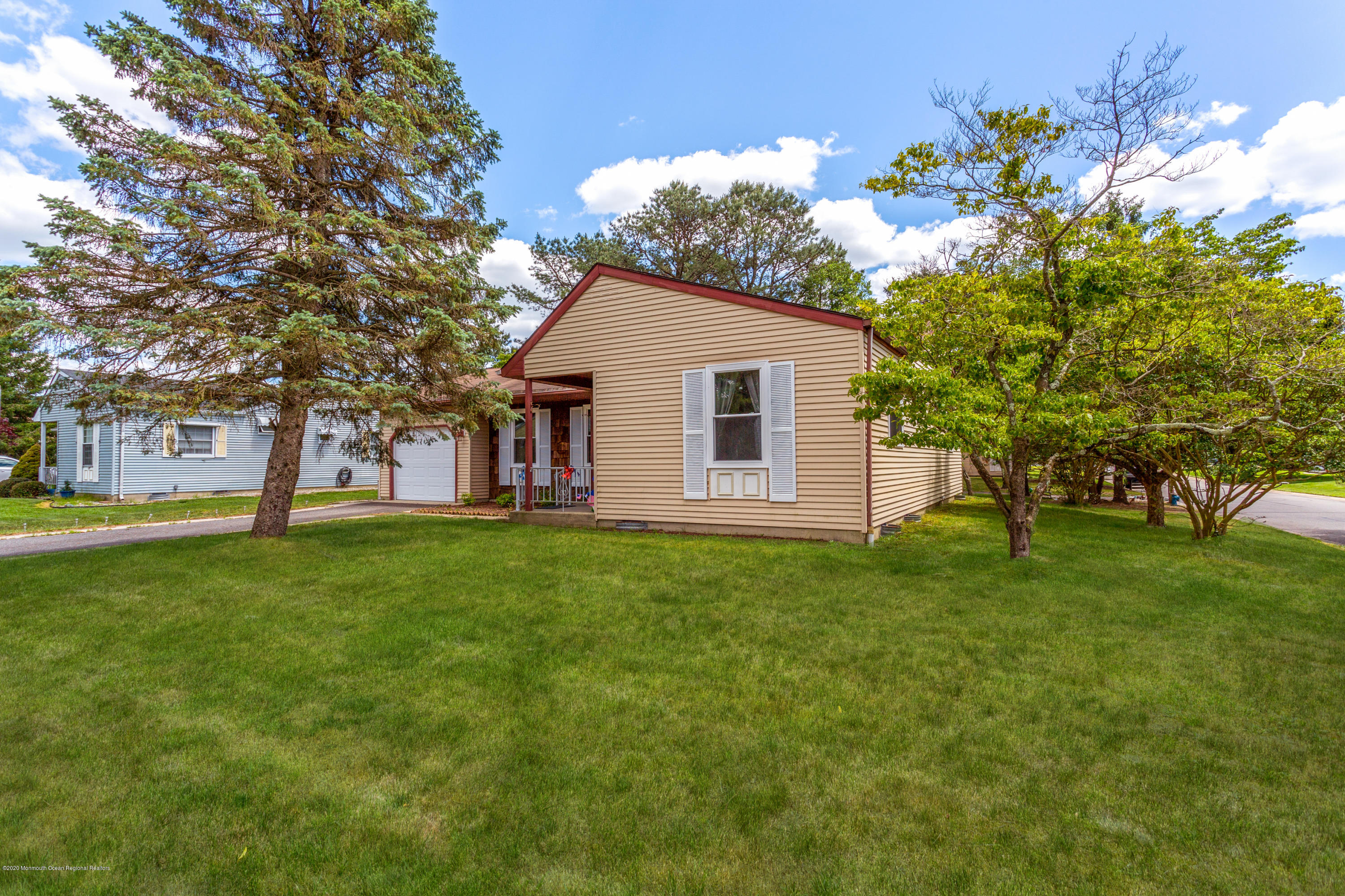 84 Sunset Road, Unit 60 Whiting, NJ 08759 - Photo 7 of 51 a view of a house with a backyard
