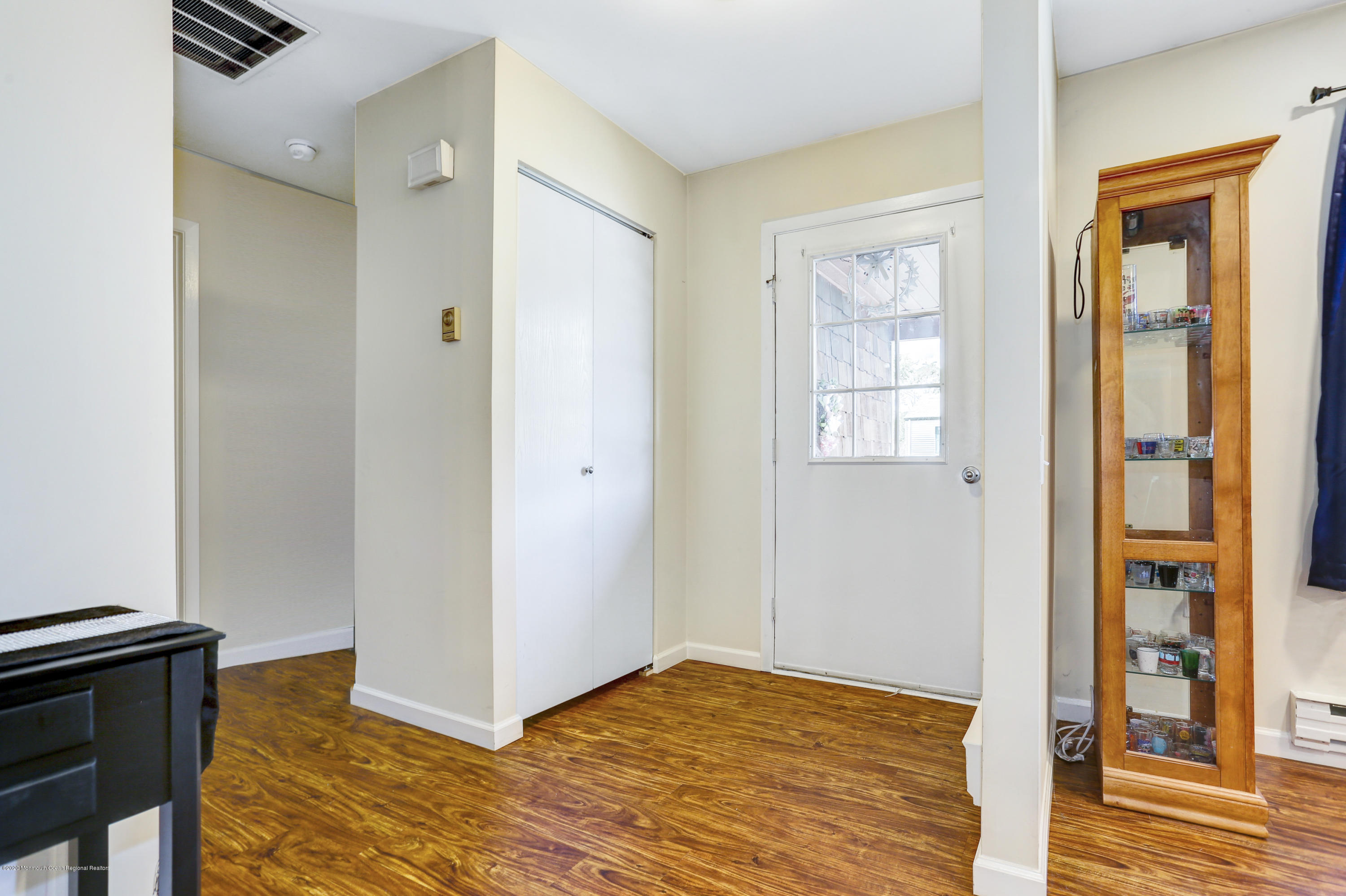 84 Sunset Road, Unit 60 Whiting, NJ 08759 - Photo 9 of 51 a view of an empty room with wooden floor and a window
