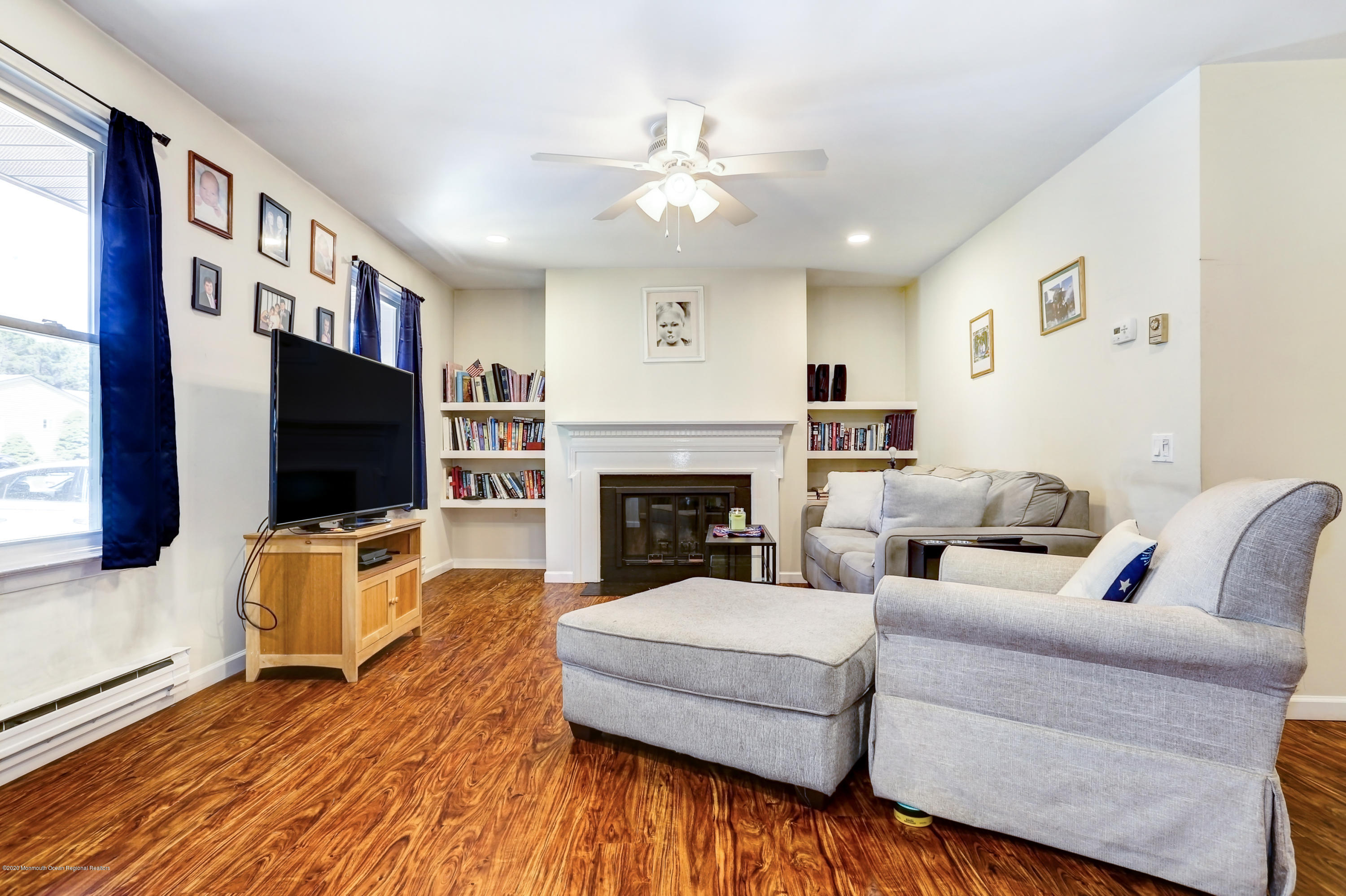84 Sunset Road, Unit 60 Whiting, NJ 08759 - Photo 10 of 51 a living room with furniture and a flat screen tv