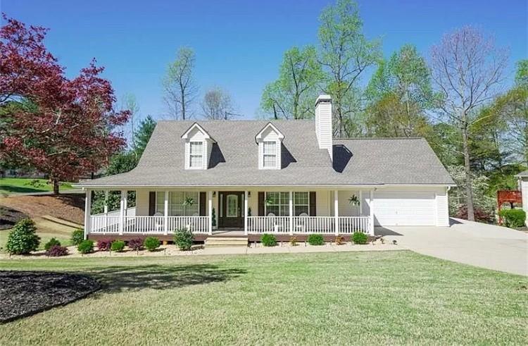 7215 Serenity Place Cumming, GA 30041 - Photo 1 of 1 a front view of a house with garden