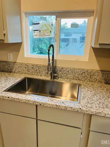 a kitchen with a sink and a window