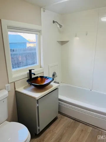 a bathroom with a sink toilet and a bathtub