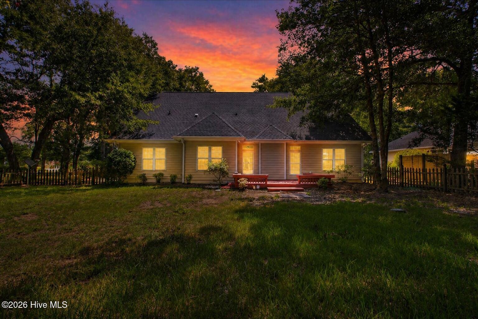 8985 Woodbine Road Southwest Sunset Beach, NC 28468 - Photo 55 of 65 Twilight photo of the back exterior.
