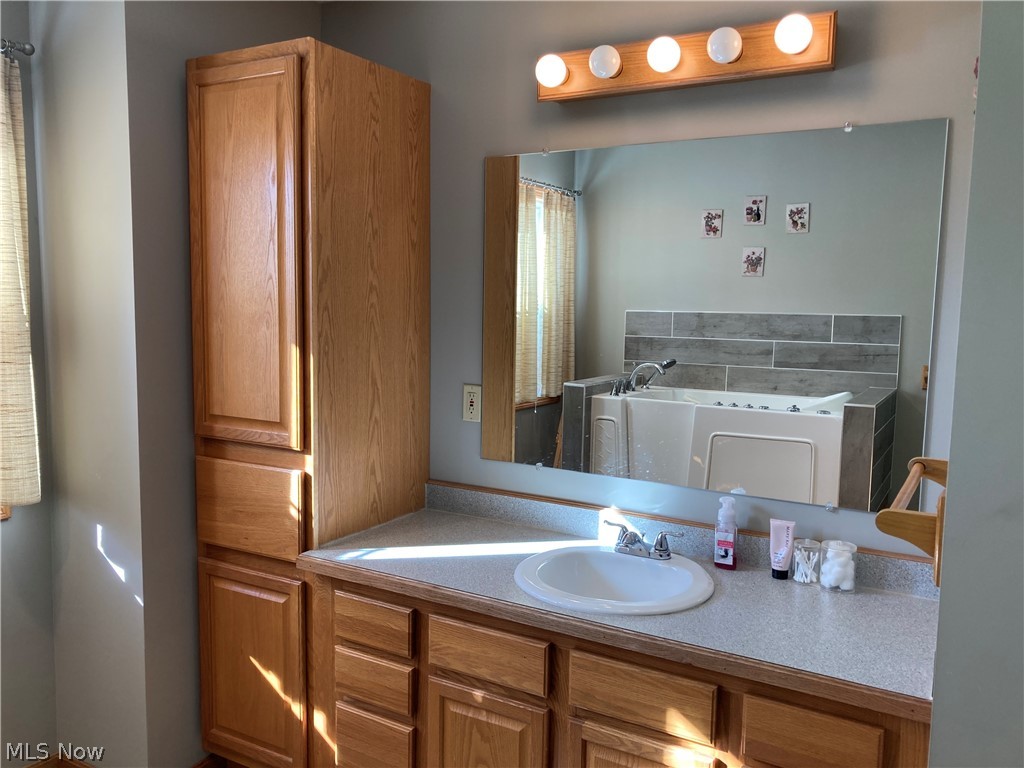 4455 Beat Road Litchfield, OH 44253 - Photo 12 of 35 Here are some additional photos of the great features of the main bath. Cabinetry to the left makes for a wonderful linen closet.