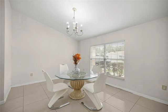 a view of a dining room with furniture wooden floor and a chandelier