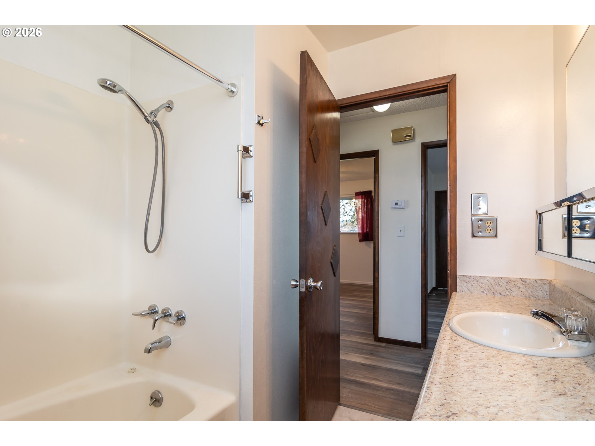 219 Hawthorne Street Sutherlin, OR 97479 - Photo 24 of 45 a bathroom with a granite countertop shower sink vanity and mirror