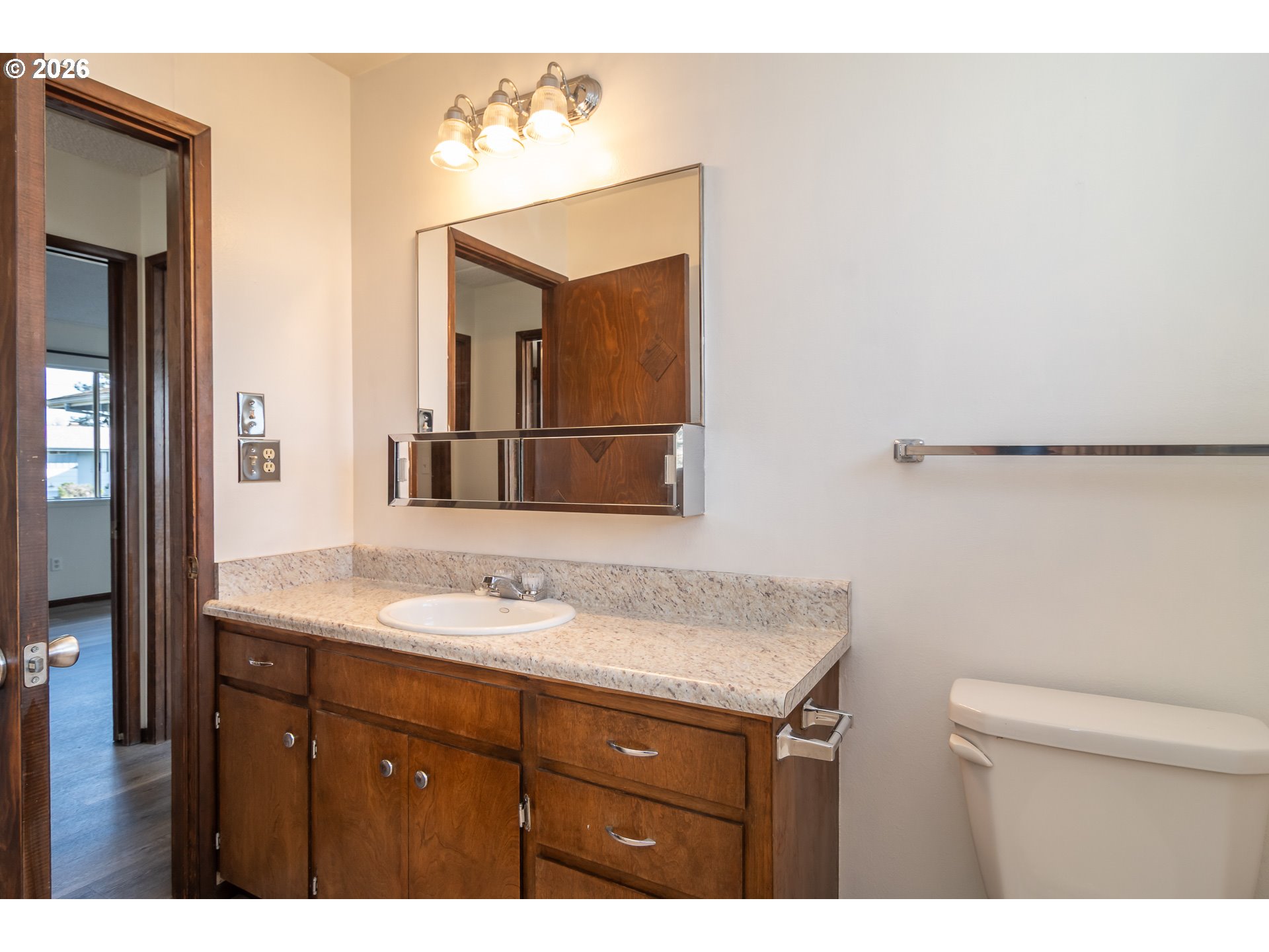 219 Hawthorne Street Sutherlin, OR 97479 - Photo 25 of 45 a bathroom with a granite countertop sink and a mirror