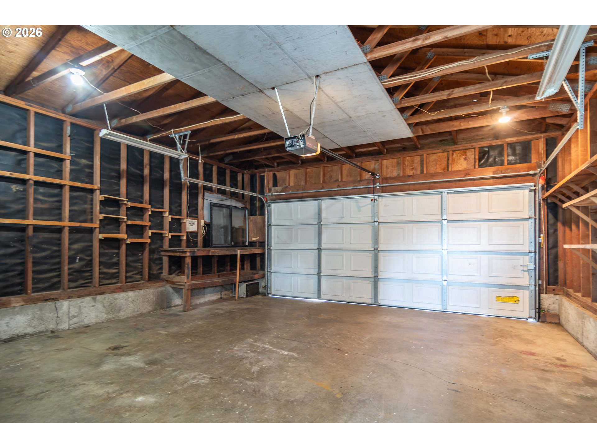219 Hawthorne Street Sutherlin, OR 97479 - Photo 43 of 45 a view of an empty room with wooden shelves