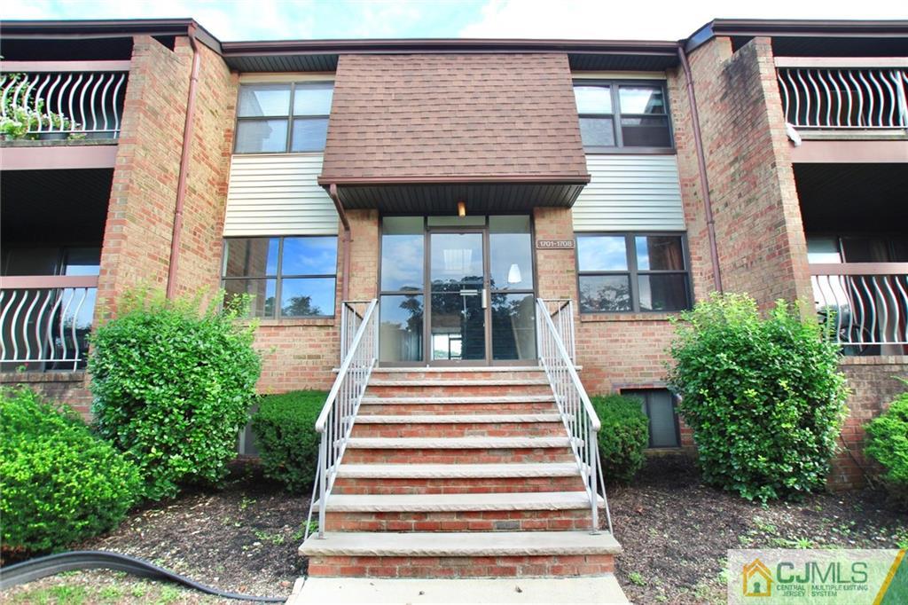 1704 Raspberry Court, Unit 1704 Edison, NJ 08817 - Photo 22 of 23 a front view of a house with a porch