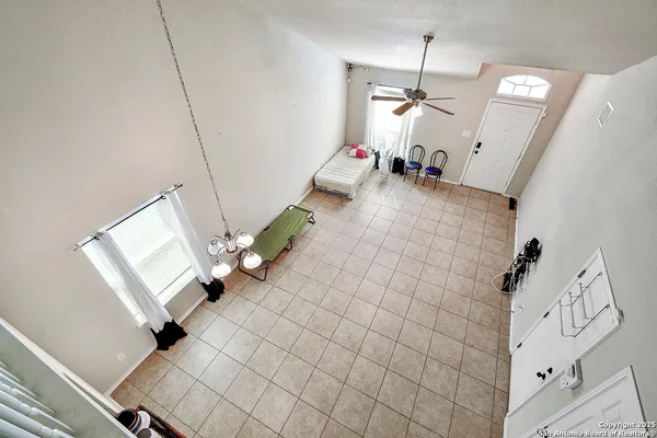 a view of living room with furniture and a chandelier