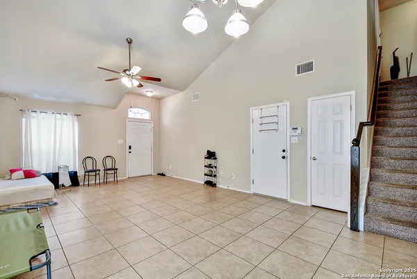 a bedroom with furniture and window
