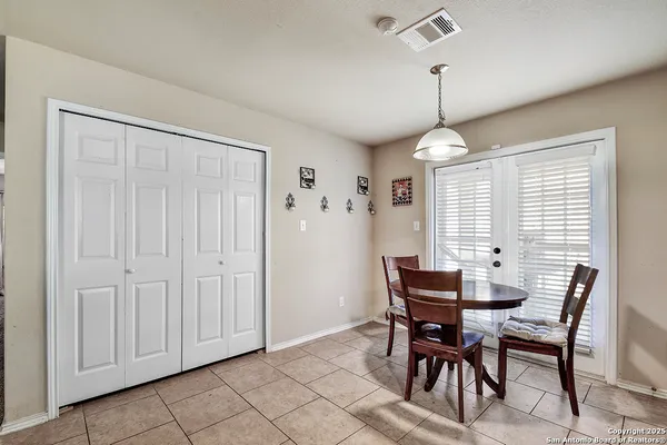 a dining room with furniture and window