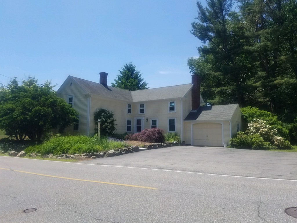 130 Argilla Road Andover, MA 01810 - Photo 1 of 24 front view of a house with a yard and a garage