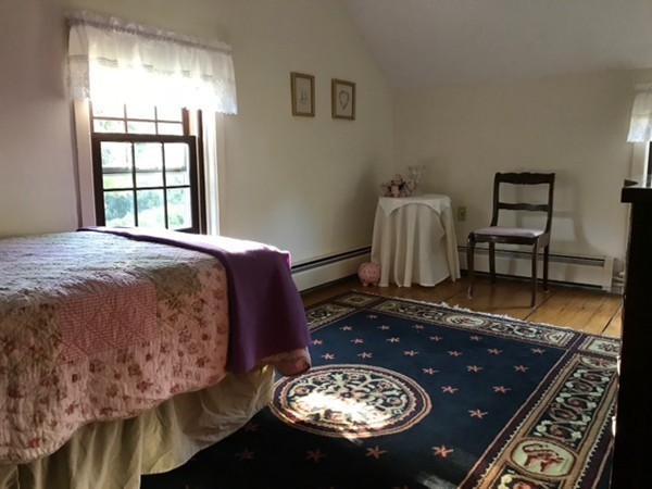 130 Argilla Road Andover, MA 01810 - Photo 14 of 24 a bedroom with a bed and a table