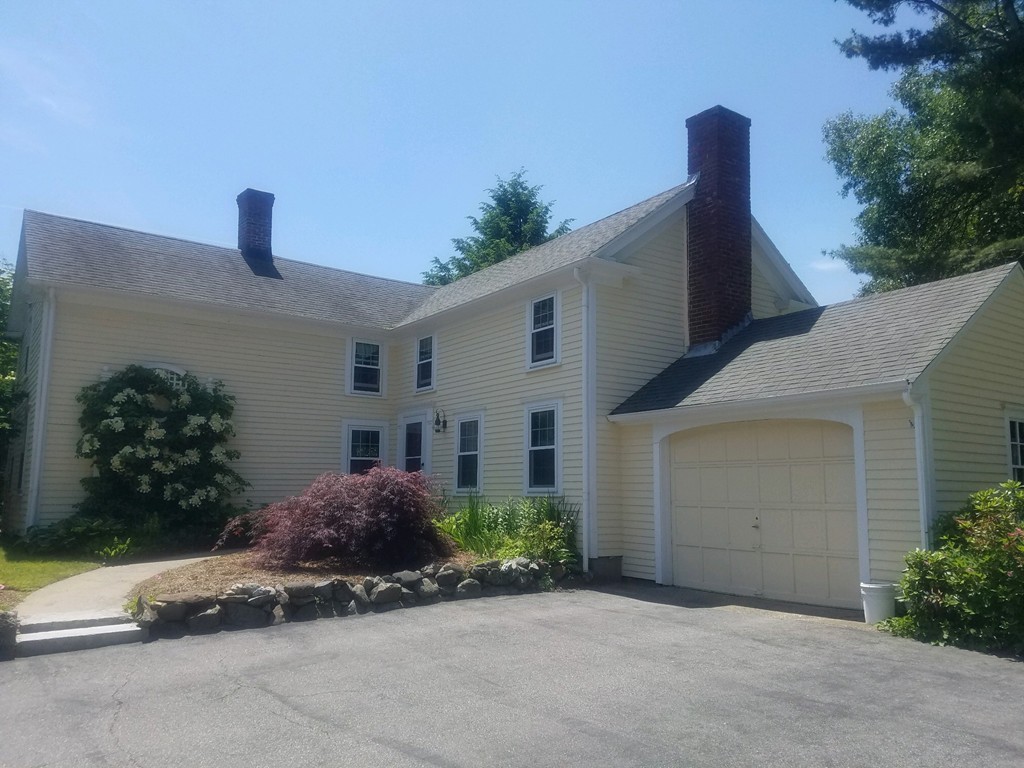 130 Argilla Road Andover, MA 01810 - Photo 2 of 24 a front view of a house with garden