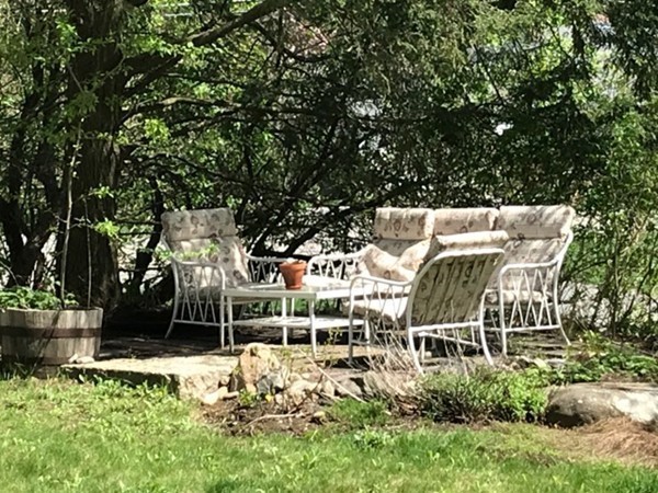 130 Argilla Road Andover, MA 01810 - Photo 21 of 24 a view of a chair and table in the garden