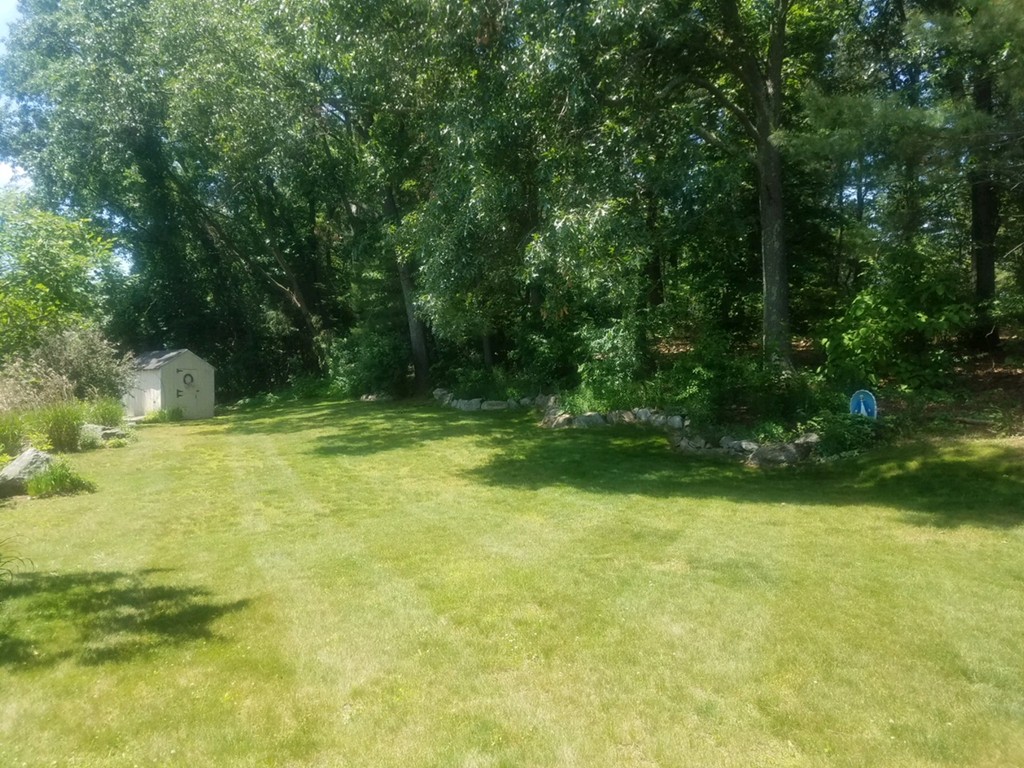 130 Argilla Road Andover, MA 01810 - Photo 22 of 24 a view of outdoor space with deck and yard
