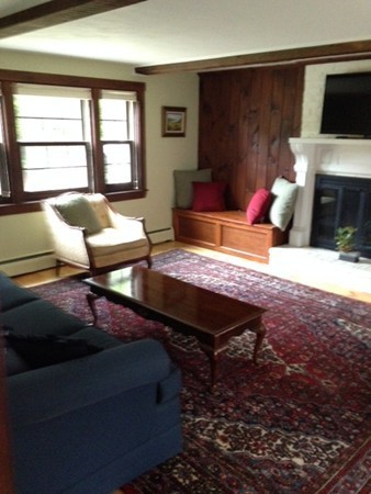 130 Argilla Road Andover, MA 01810 - Photo 5 of 24 a living room with furniture and a fireplace