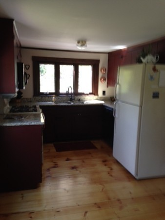 130 Argilla Road Andover, MA 01810 - Photo 8 of 24 a kitchen with a refrigerator and a stove
