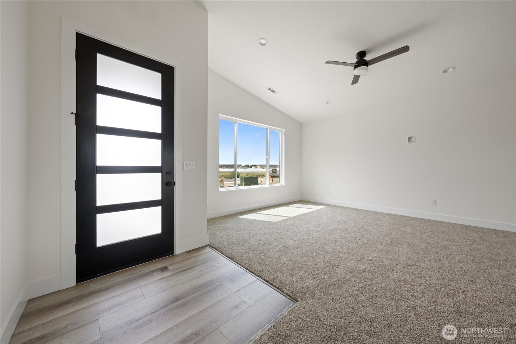 721 O Street Southwest Quincy, WA 98848 - Photo 16 of 33 a view of an empty room with a window and wooden floor