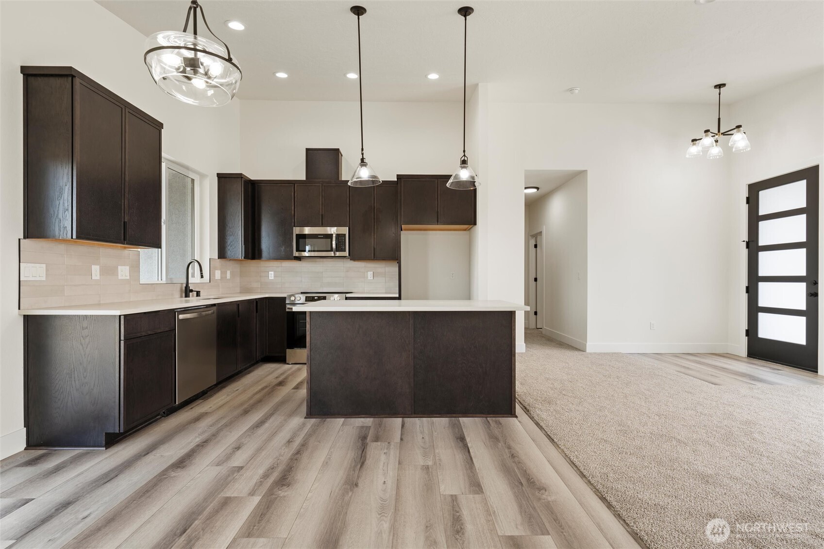 721 O Street Southwest Quincy, WA 98848 - Photo 20 of 33 a large kitchen with kitchen island a sink stainless steel appliances and cabinets
