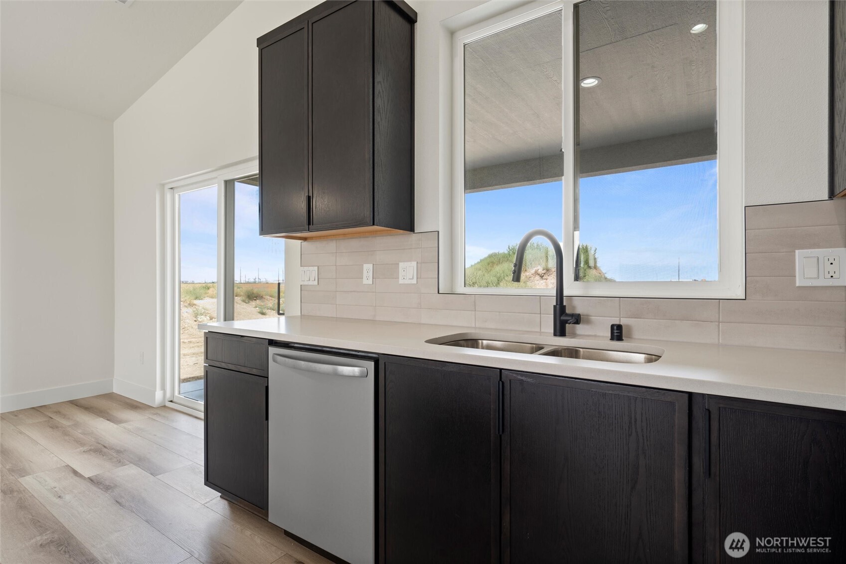 721 O Street Southwest Quincy, WA 98848 - Photo 24 of 33 a kitchen with a sink and cabinets