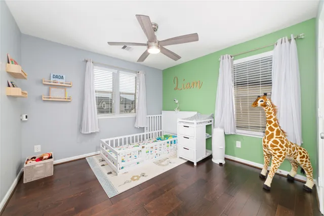 a bedroom with furniture and a window