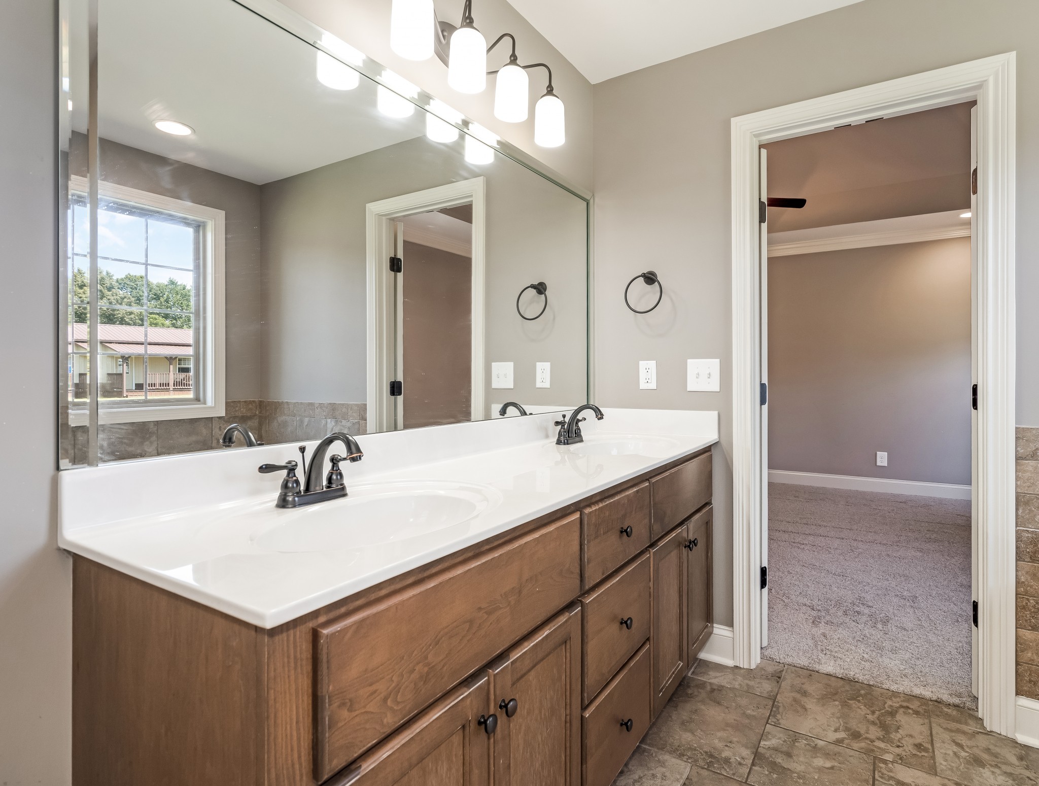 816 Burford Road Lebanon, TN 37087 - Photo 27 of 41 a bathroom with a sink double vanity and a mirror