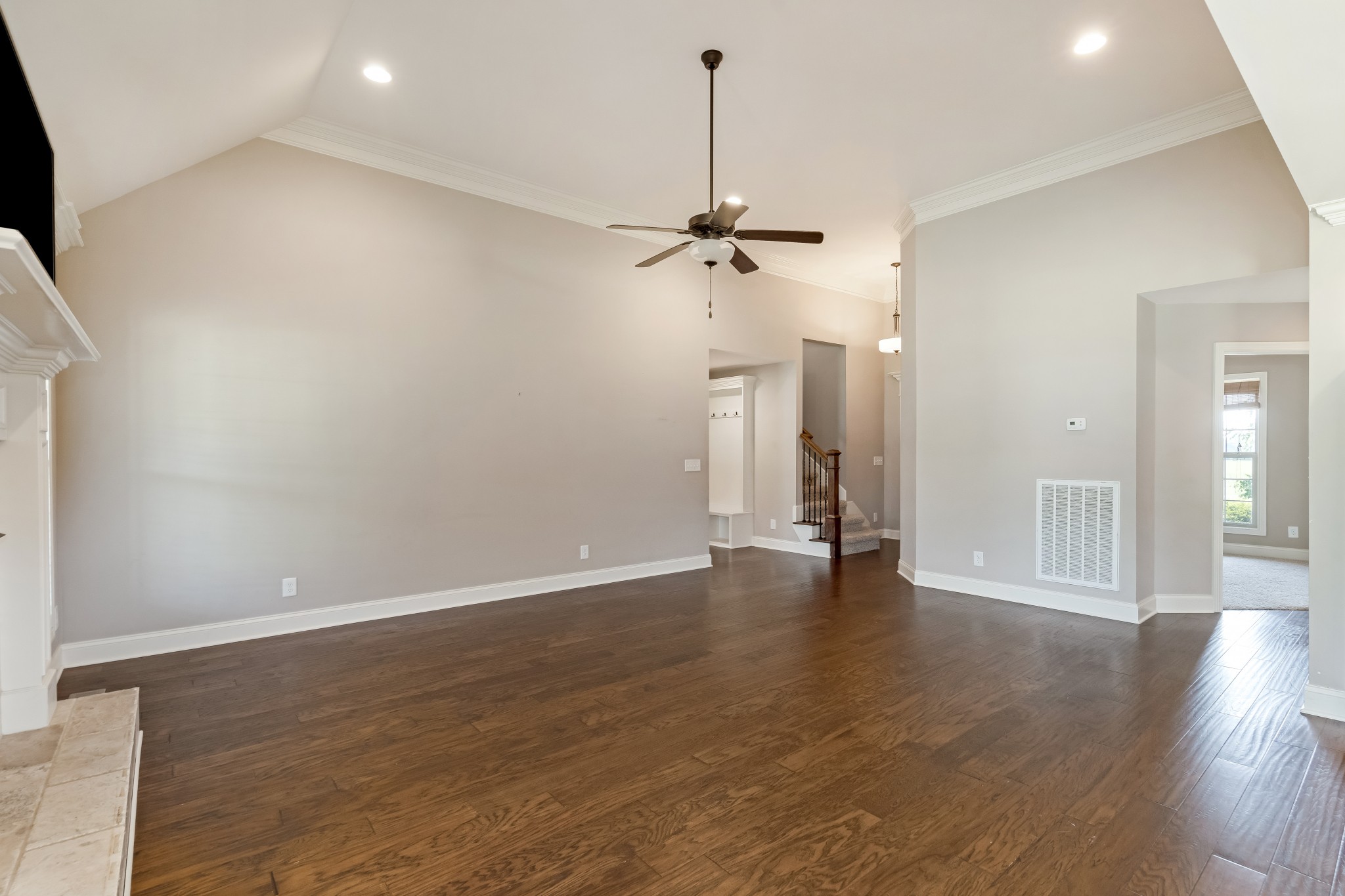 816 Burford Road Lebanon, TN 37087 - Photo 8 of 41 a view of an empty room with wooden floor and a ceiling fan